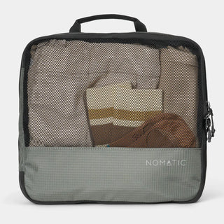 NOMATIC large Compression Packing Cube in moss, mesh top showing packed clothing