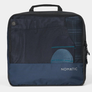 NOMATIC large Compression Packing Cube in navy, mesh top showing packed clothing