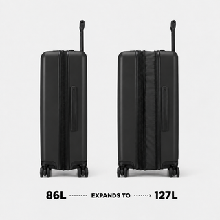NOMATIC Method Check-In Large in black, front and back view showing expansion from 86L to 127L