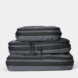 nomatic.mompression Packing Cubes in gray, compressed and stacked, top view