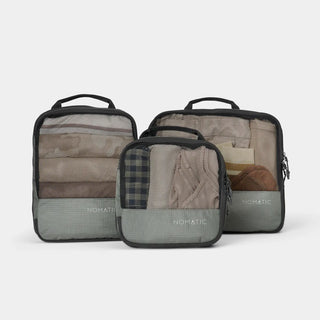 nomatic.mompression Packing Cubes in moss, set of three shown together