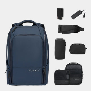 NOMATIC Travel Pack Bundle - Elite in navy, flat-lay of the backpack with wallet, luggage tag, access sling, toiletry bag, and packing cubes