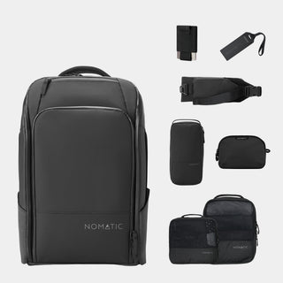 NOMATIC Travel Pack Bundle - Elite in black, flat-lay of the backpack with wallet, luggage tag, access sling, toiletry bag, and packing cubes