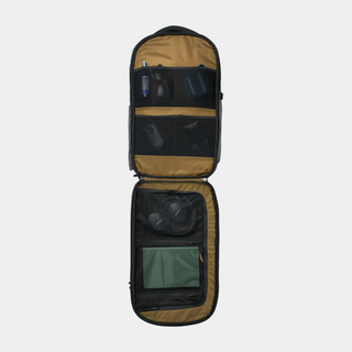 Open travel bag with compartments on a white background